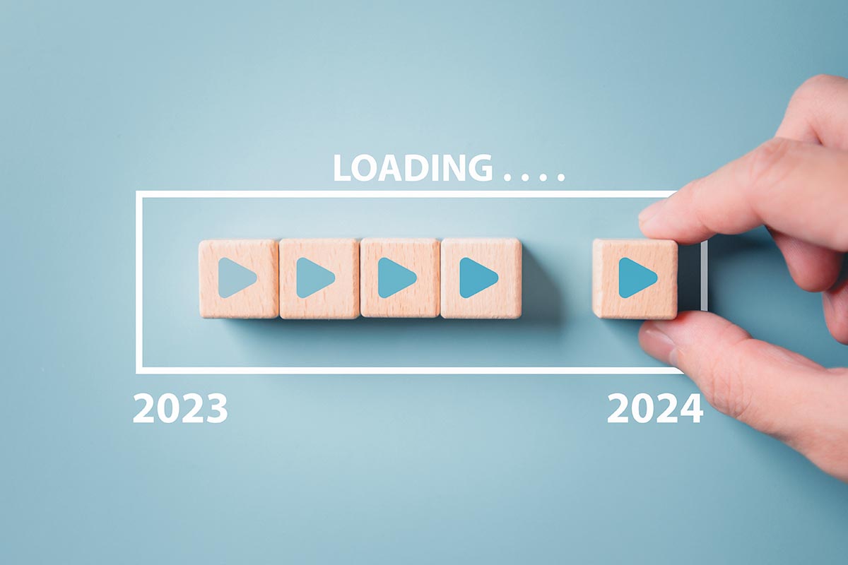 2024 New Year countdown loading. Loading bar on wooden blocks 2023 to 2024 on blue background. The beginning of the starting goal and action plan concept.