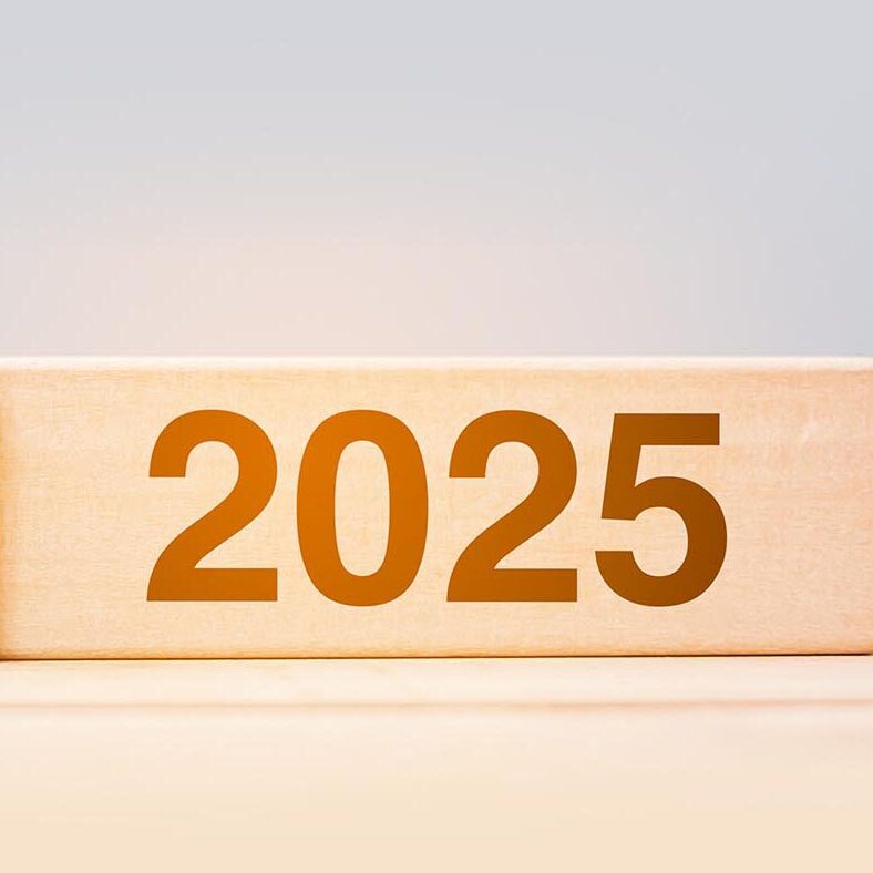 2025 and 2024 wooden block on table background. Resolution, strategy, countdown, goal, change and New Year holiday concepts