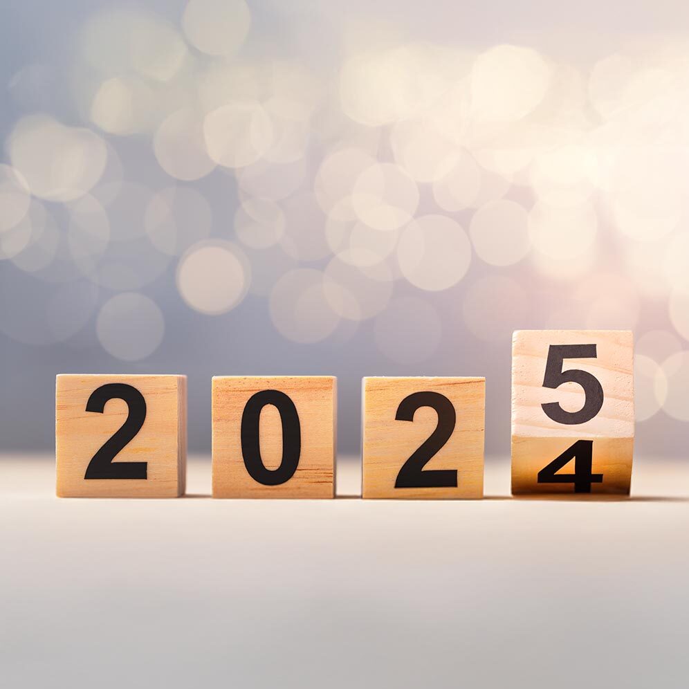 Flipping wooden cubes with the Year number 2024 and 2025, New Year concept