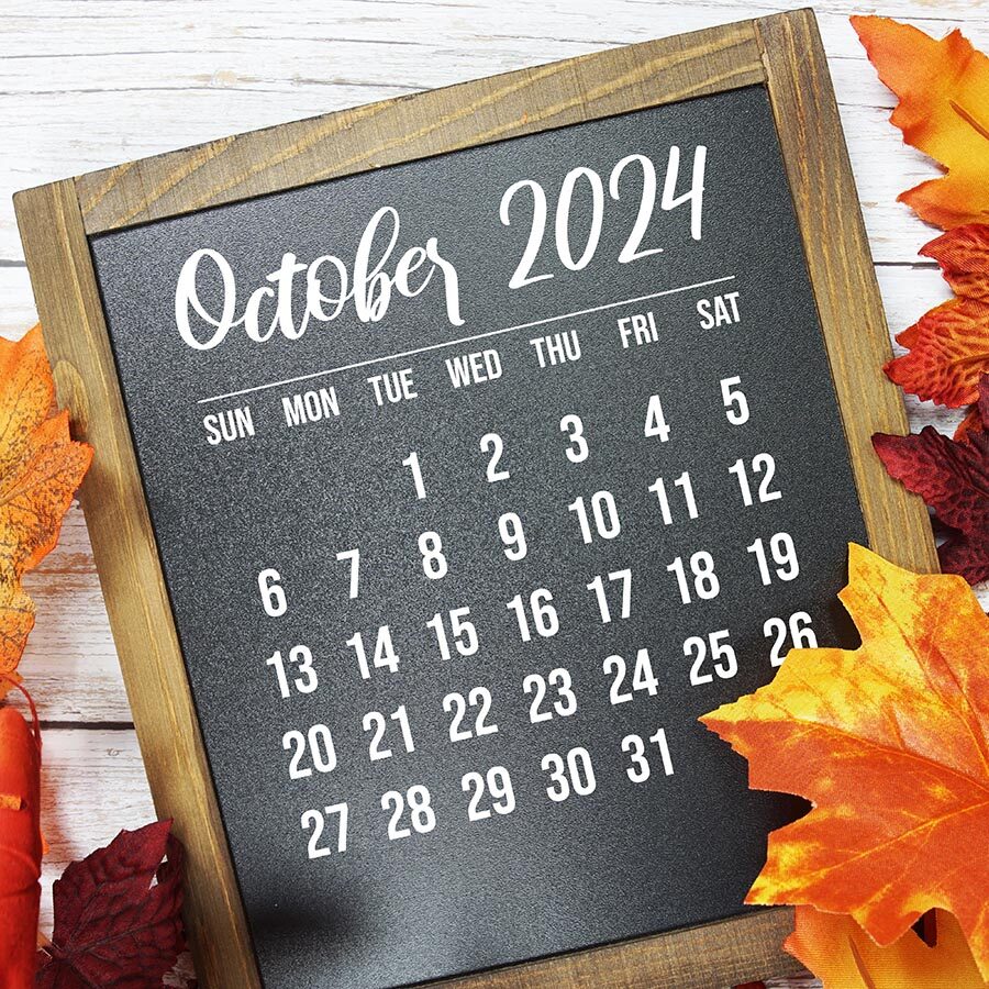 October 2024 monthly calendar maple leaf decoration on wooden background